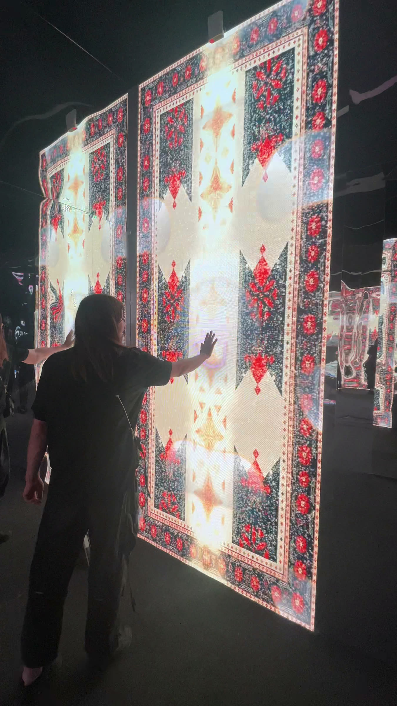 Visitor triggering the pattern maze's touch-reactive screen